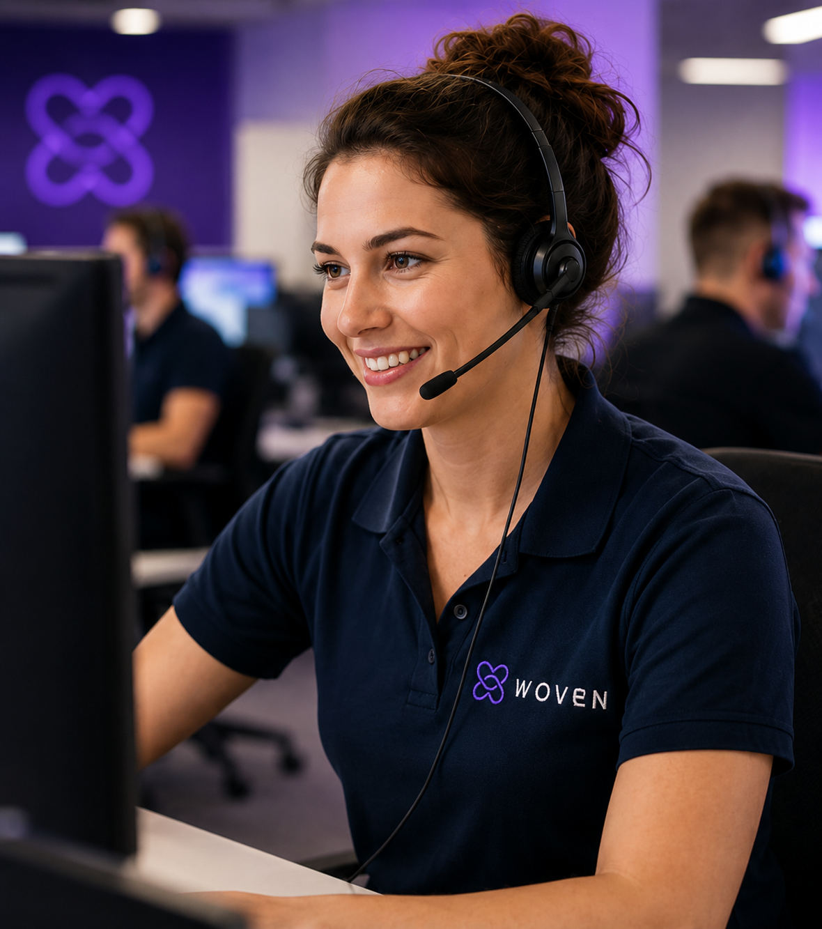 UK customer experience team in a modern workspace, collaborating on calls and digital conversations